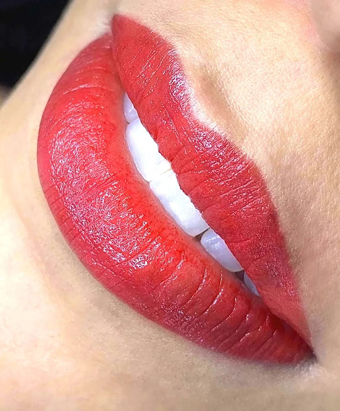 Close-up of a lip blush treatment showing rich, even colour and defined shape